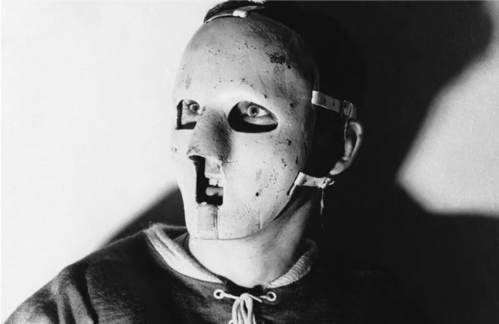 Jacques Plante wearing the first goalie mask.