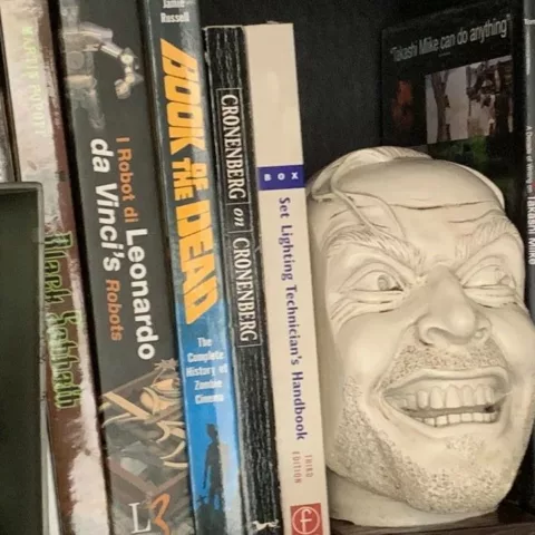 Jack Torrence on a book shelf