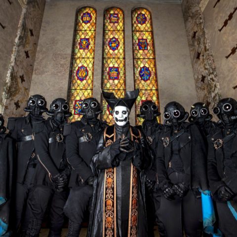 Photo of the band GHOST in front of a church