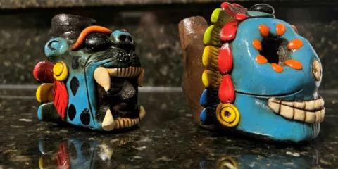 Side photo of screaming Aztec death and jaguar whistle