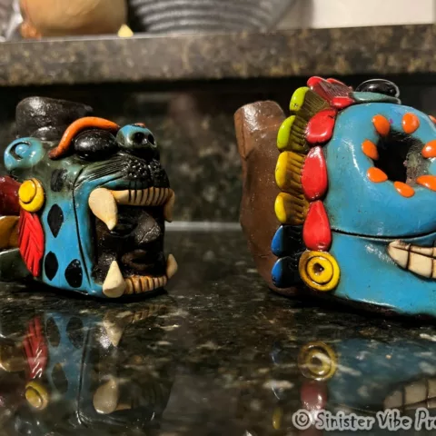Side photo of screaming Aztec death and jaguar whistle
