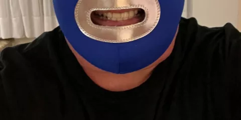 Smite wearing Blue Demon mask