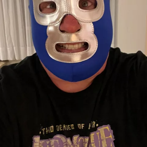 Smite wearing Blue Demon mask