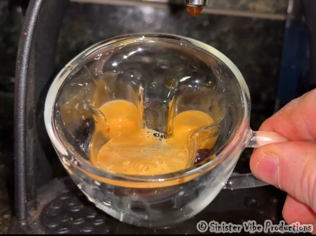 Photo of espresso coffee in Mickey Mouse glass