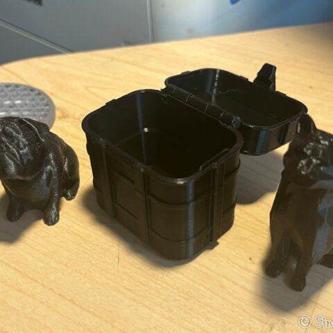 photo of 3d prints of a dog, a box and a cat