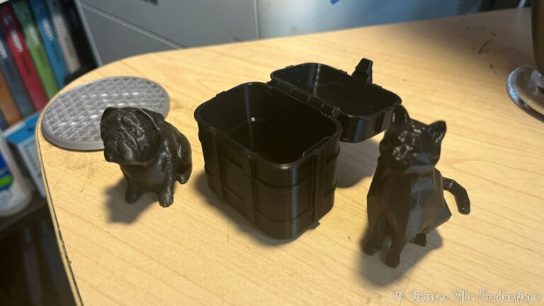 photo of 3d prints of a dog, a box and a cat