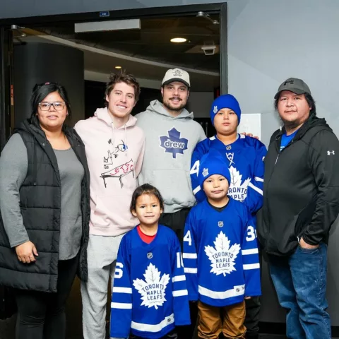 Toronto Maple Leafs with young hockey fans.