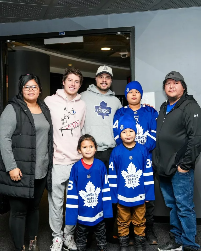 Toronto Maple Leafs with young hockey fans.