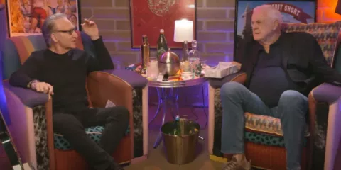 Photo of John Cleese and Bill Mayer drinking