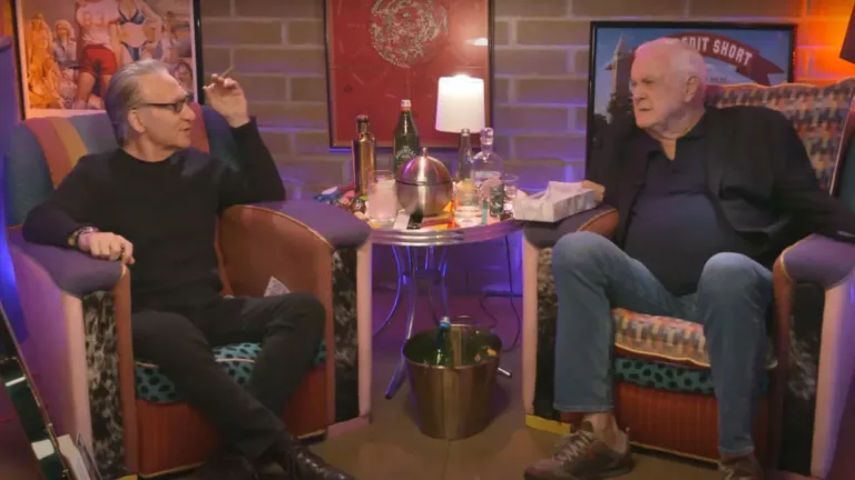 Photo of John Cleese and Bill Mayer drinking