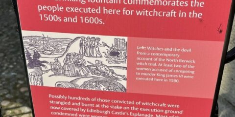 Photo of The Witches' Well signage in Edinburgh, Scotland