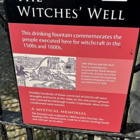 Photo of The Witches' Well signage in Edinburgh, Scotland