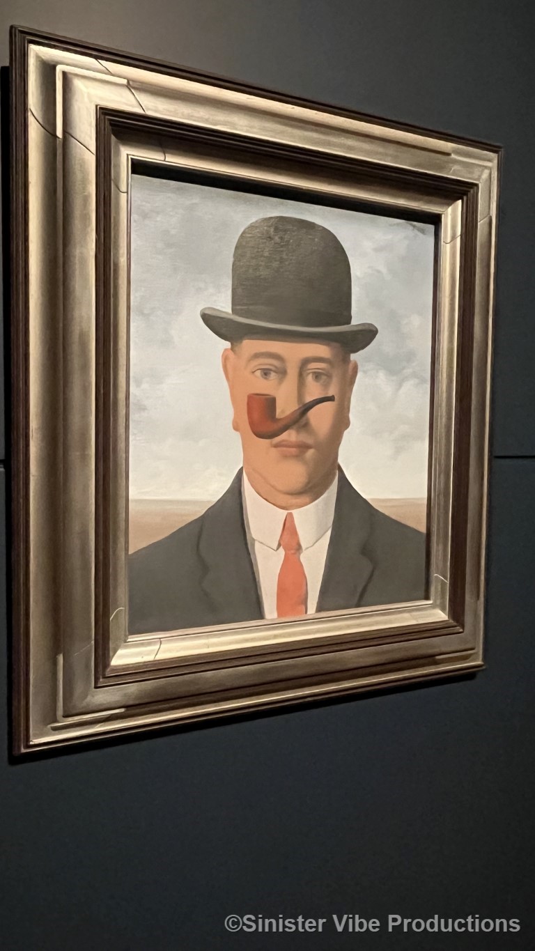 Photo of painting of man win bowler hat and pipe