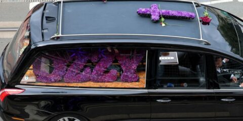 Photo of hearse containing Ozzy Osbourne's coffin