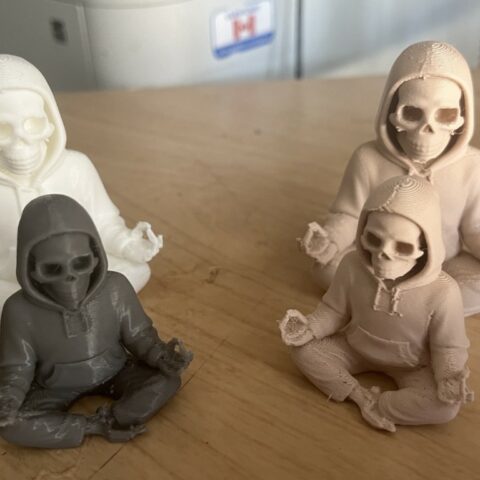 photo of a group of skeletons in hoodie