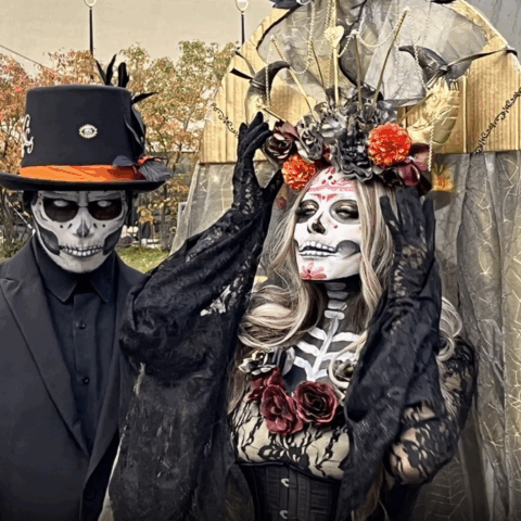 Feliz Día de los Muertos from our backyard. photo of two dia de los muertos characters