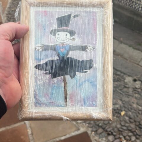 photo of a watercolour painting of Turnip_Head from Studio Ghibli's Howls Moving Castle