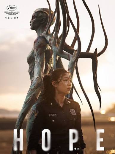 Korean film poster "Hope" with a police officer in uniform beside a towering winged bronze statue at sunset